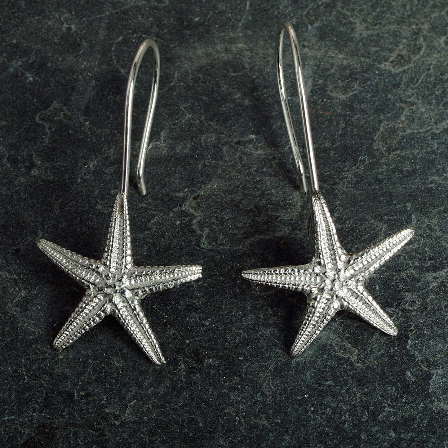 Starfish drop earrings, pewter starfishes on Sterling silver ear hooks. Pewter and silver starfish jewellery gifts, handmade in the UK by Glover and Smith