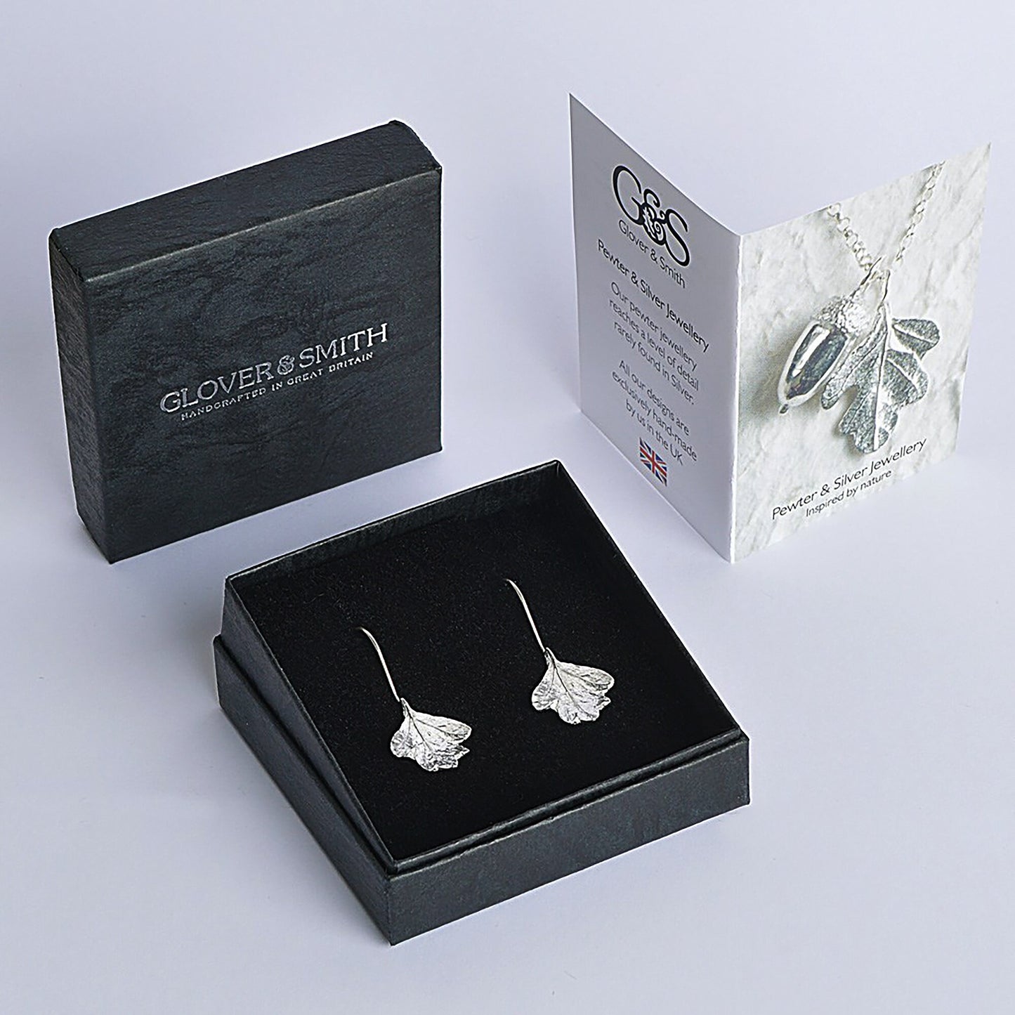 Hawthorn leaf drop earrings, pewter hawthorn leaves on Sterling silver ear hooks. Pewter and silver leaf jewellery gifts, handmade in the UK by Glover and Smith