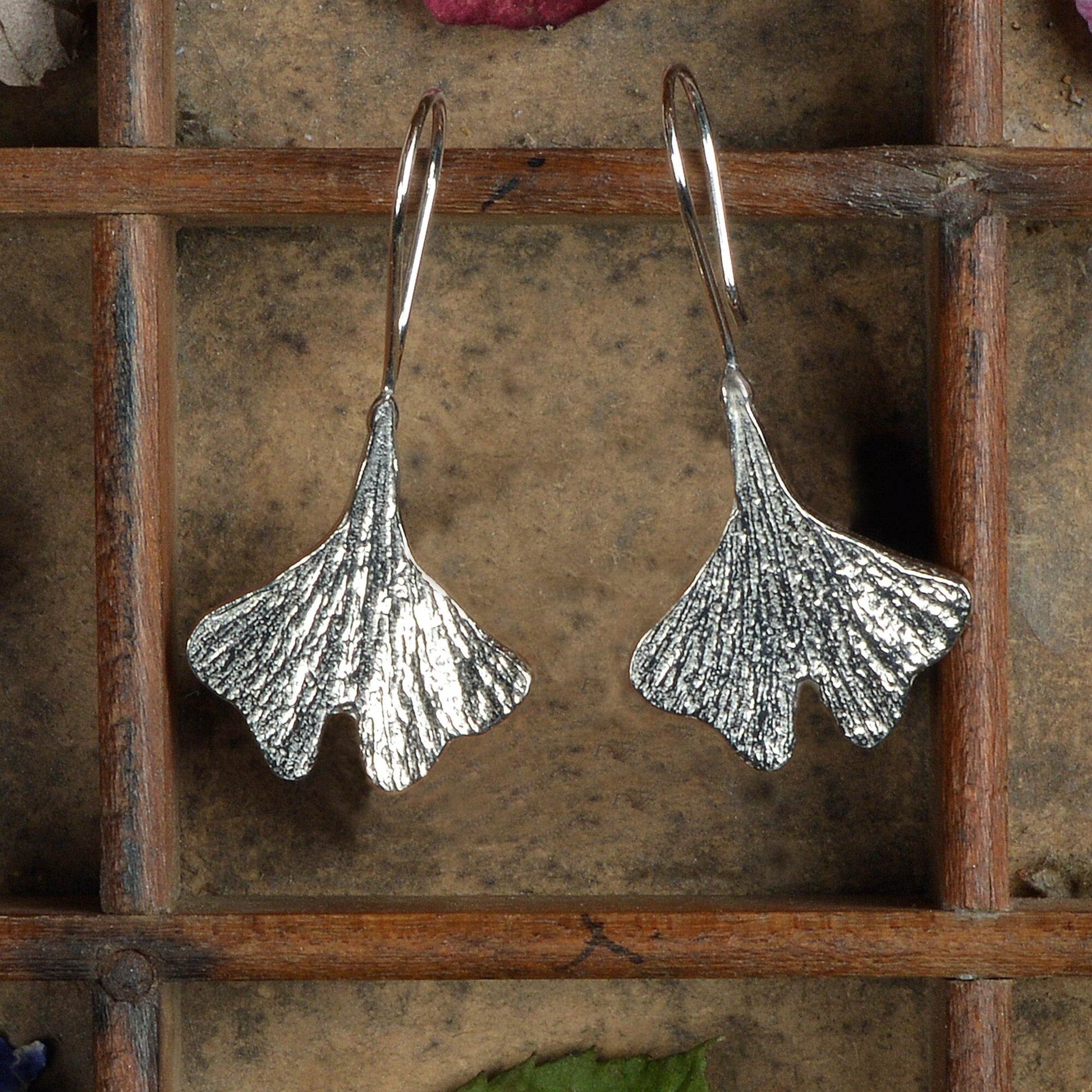 Ginkgo leaf drop earrings, pewter ginkgo leaves on Sterling silver ear hooks. Pewter and silver ginkgo leaf jewellery gifts, handmade in the UK by Glover and Smith