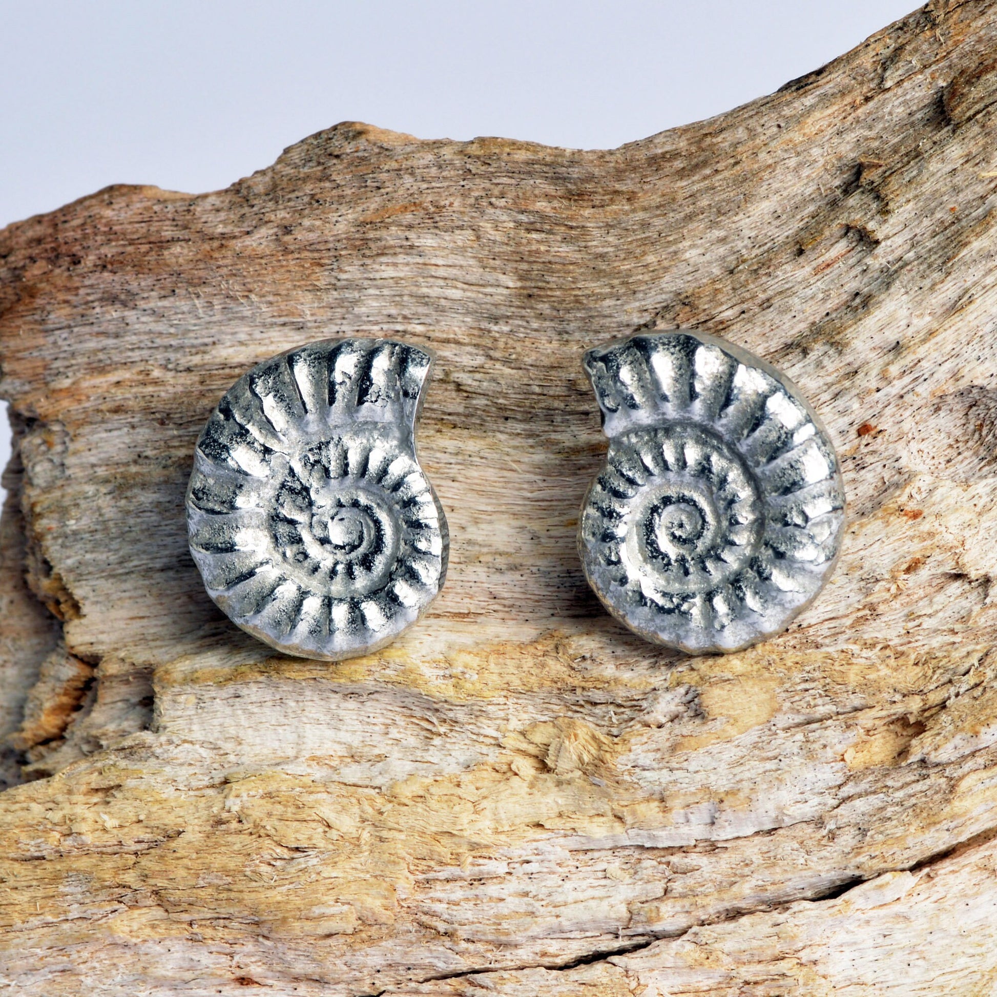 Ammonite stud earrings, pewter ammonite fossils on Sterling silver stud posts. Pewter and silver ammonite jewellery gifts, handmade in the UK by Glover and Smith