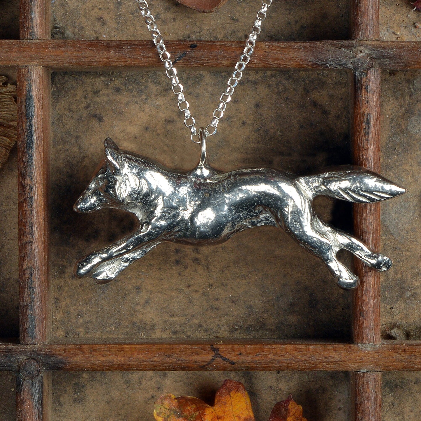 A detailed pewter running fox necklace on an 18" Sterling silver chain. Great jewellery gifts for her, fox gifts for fox lovers. Hunting gifts, country gifts. The perfect 10th tin 10 year wedding anniversary gift (Our pewter is 95% tin). Made in Britain with love. 