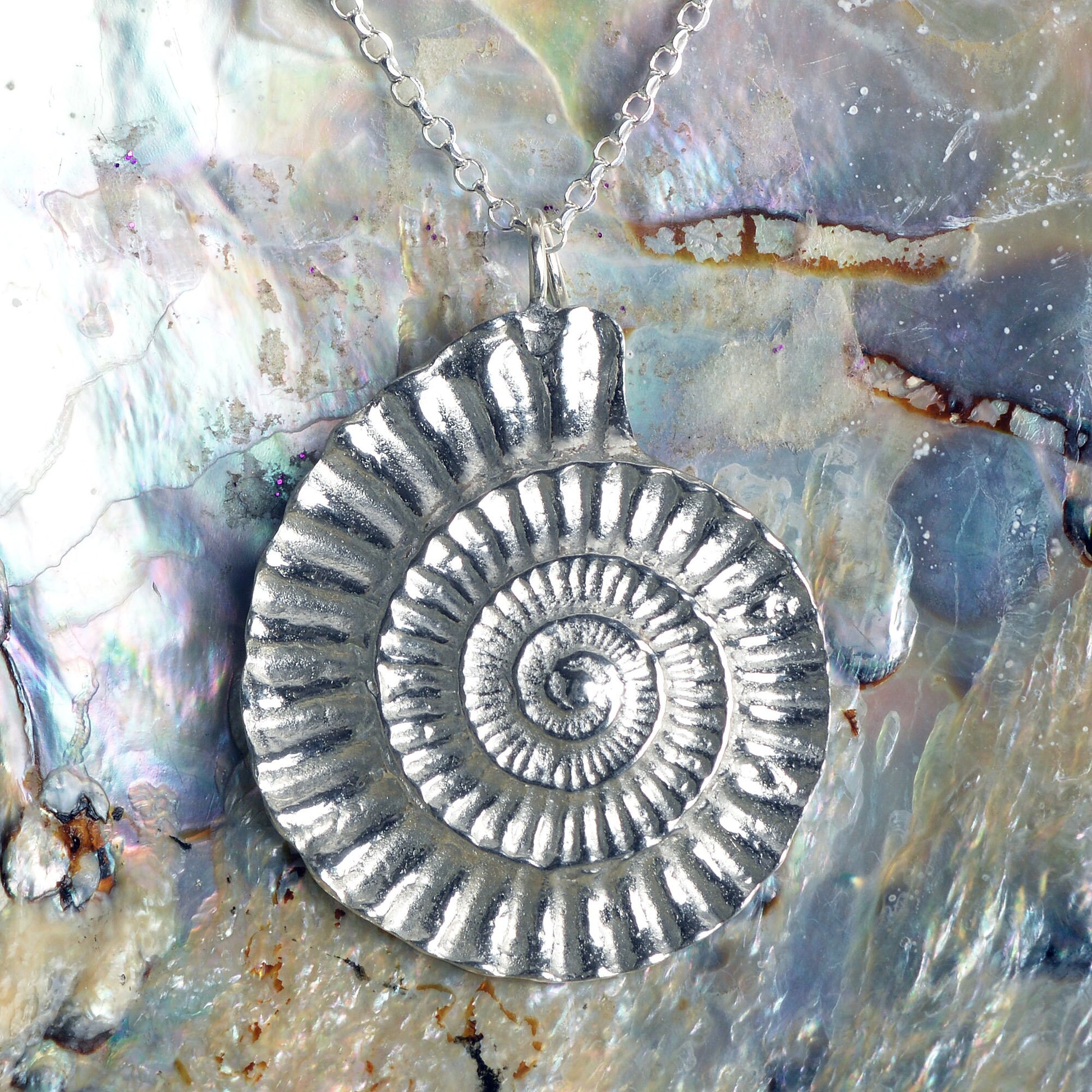 A detailed pewter ammonite fossil necklace on an 18" Sterling silver chain. Gifts for fossil lovers, ammonite nautical gifts, geology gifts. Great jewellery gifts for her. The perfect 10th tin 10 year wedding anniversary gift (Our pewter is 95% tin). Made in Britain with love.