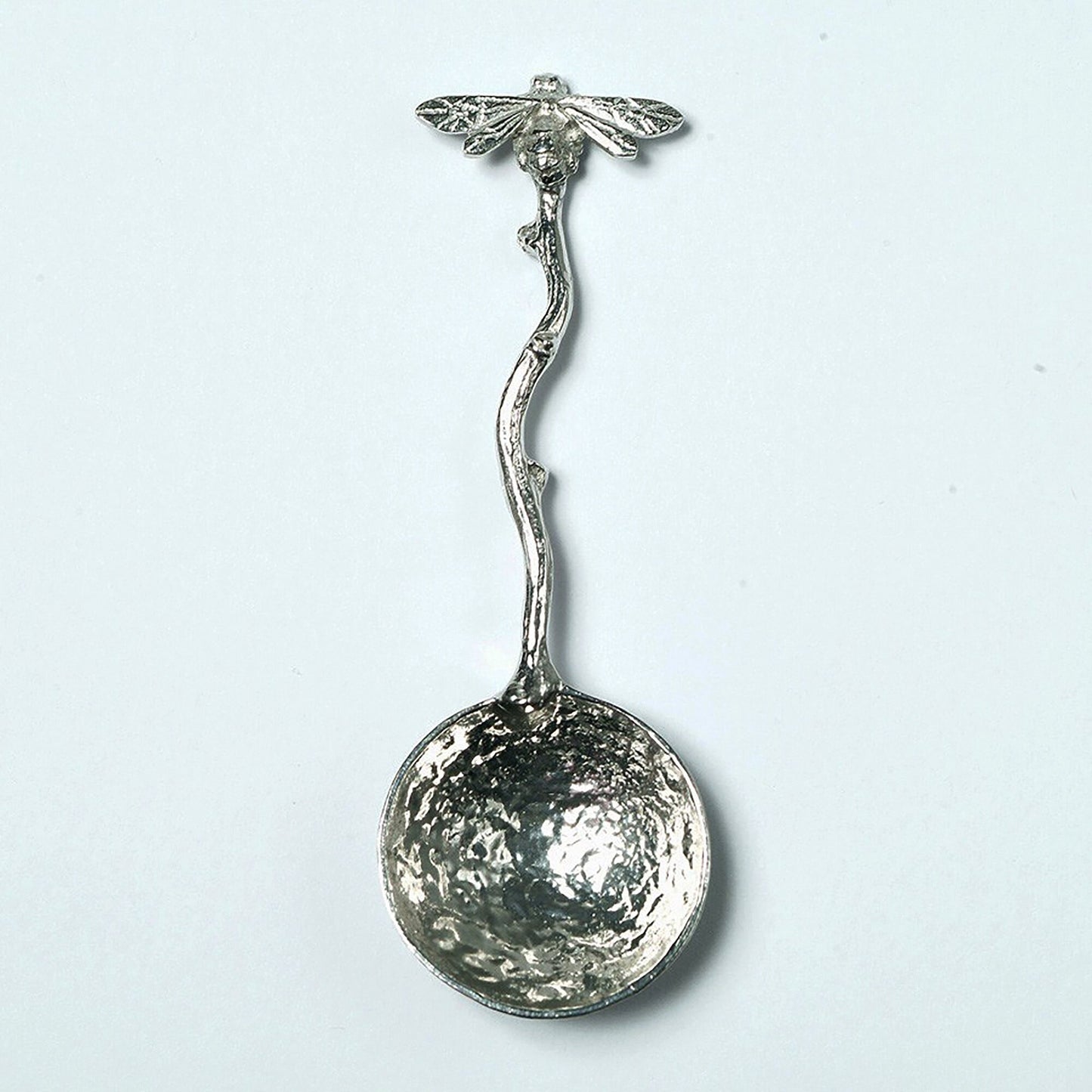 A small spoon pewter sugar spoon with a bee on the end of a twig handle. Unusual, useful and tactile gifts for bee lovers, bee gifts handmade in the UK