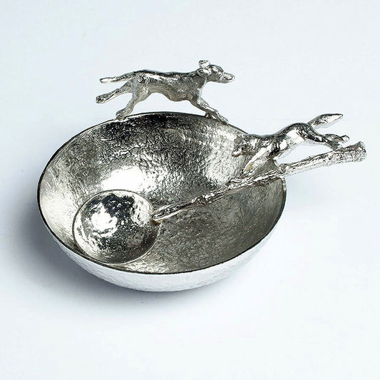 A magnificent hound bounds around the rim of a large textured, circular pewter bowl, chasing the accompanying spoon with a cunning fox on the end of its handle. Perfect gifts for lovers of the great British countryside. Country gifts, hunting gifts.