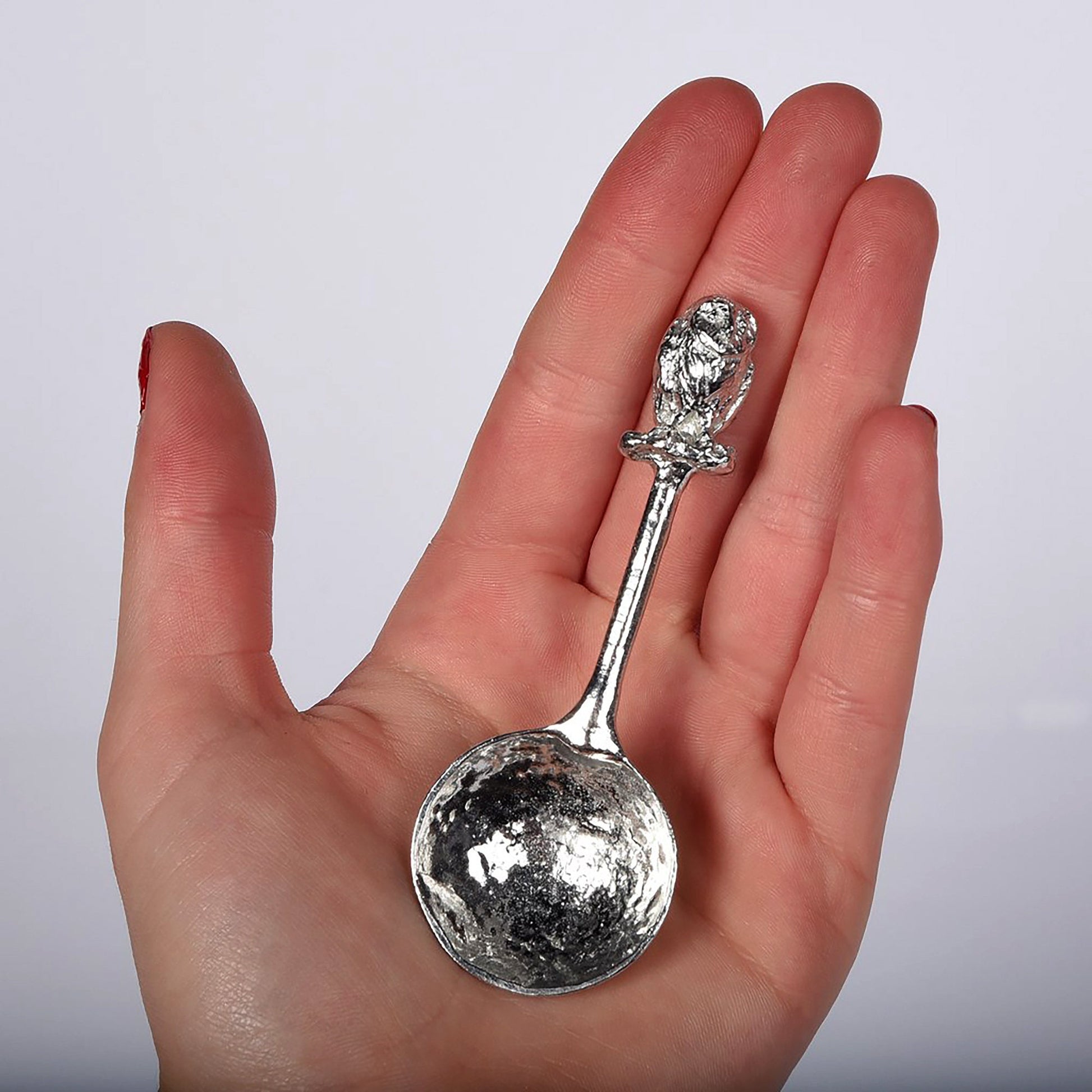 A small spoon pewter sugar spoon. A round bowled spoon on a straight handle leads to a perfectly sculpted owl. Practical & useful bird gifts for bird lovers. UK handmade