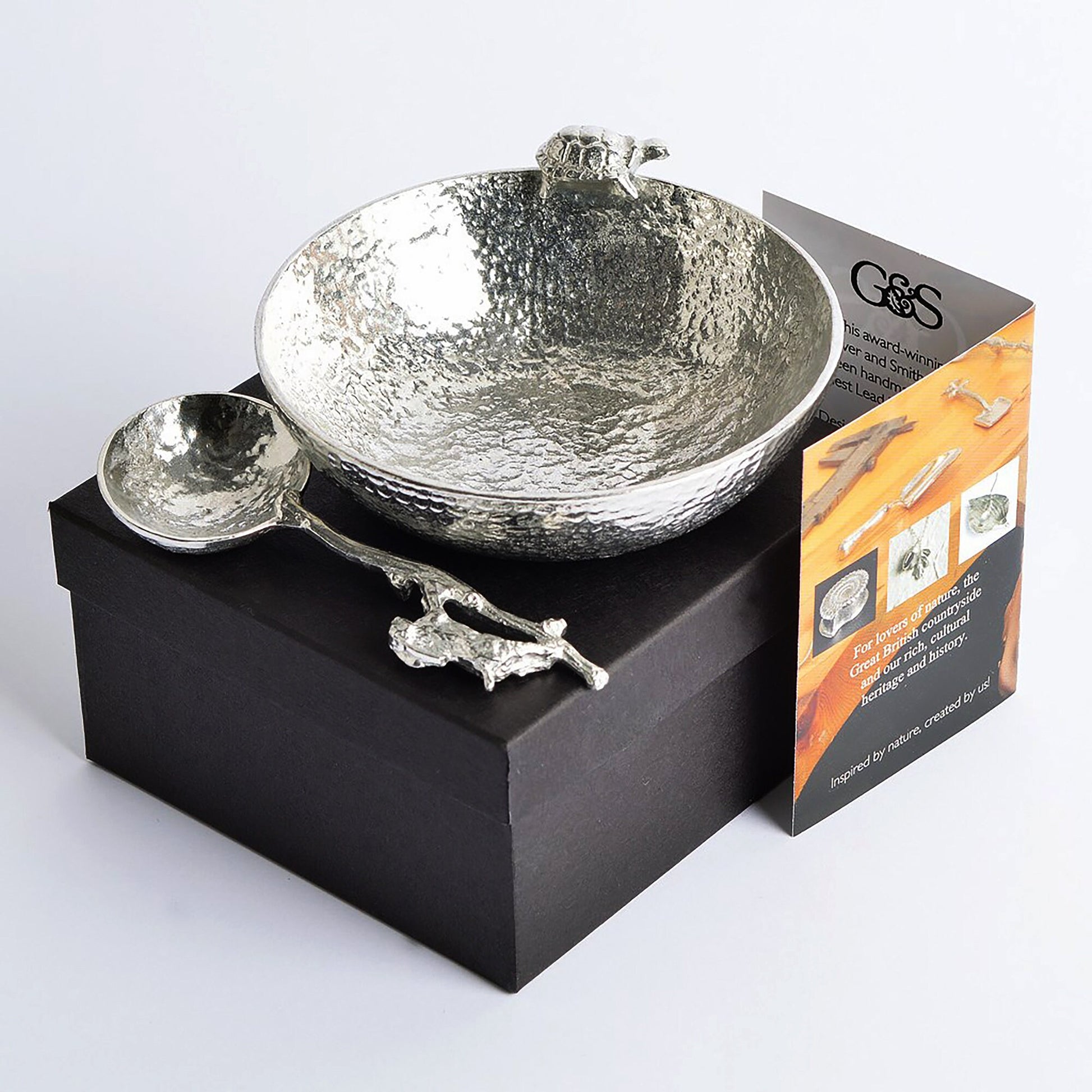 Hare and Tortoise pewter bowl and spoon set. A 9cm diameter textured circular pewter bowl, inspired by the well-known Aesop fable, with a delightful tortoise on the edge of the dish & an accompanying hare spoon. UK handmade