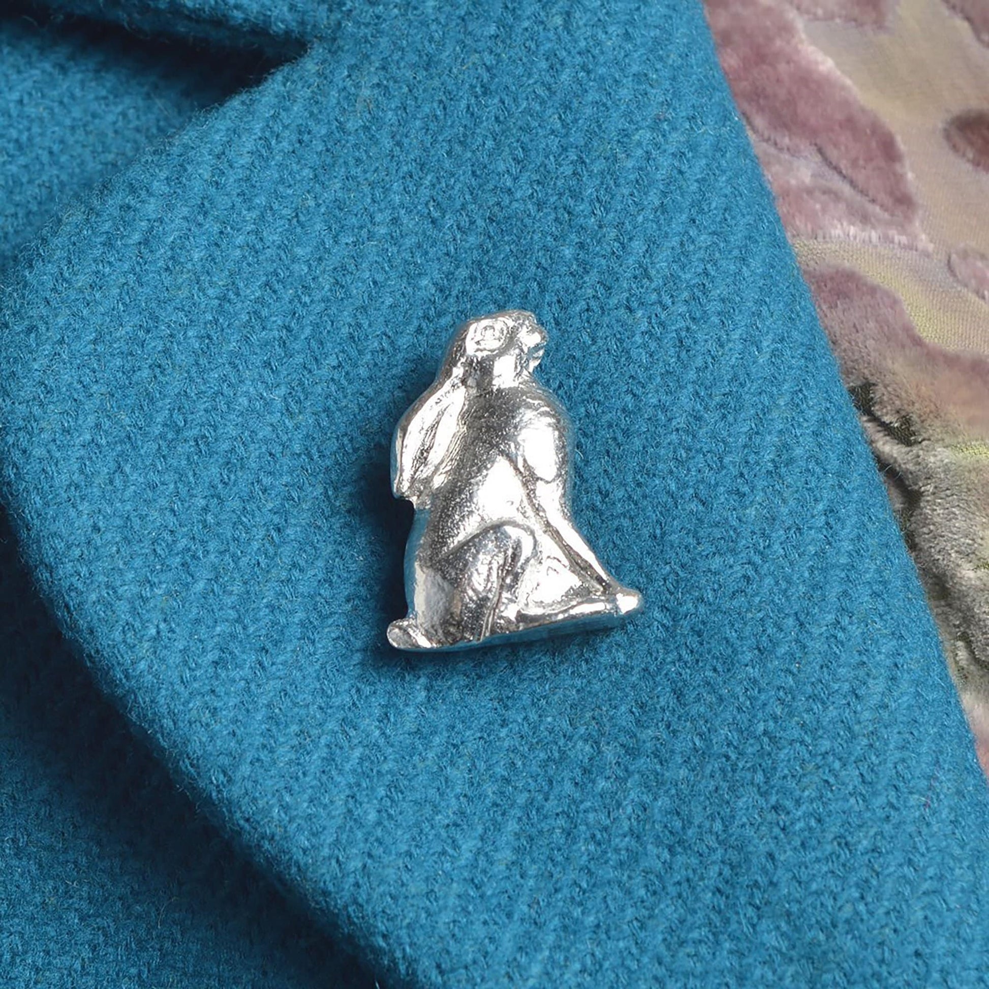 An eye catching moongazing hare pewter brooch. Hare gifts for hare lovers. Each hare brooch is 3.3cm (1.3 inches) tall and is attached with a metal clasp pin. Handmade in Britain.