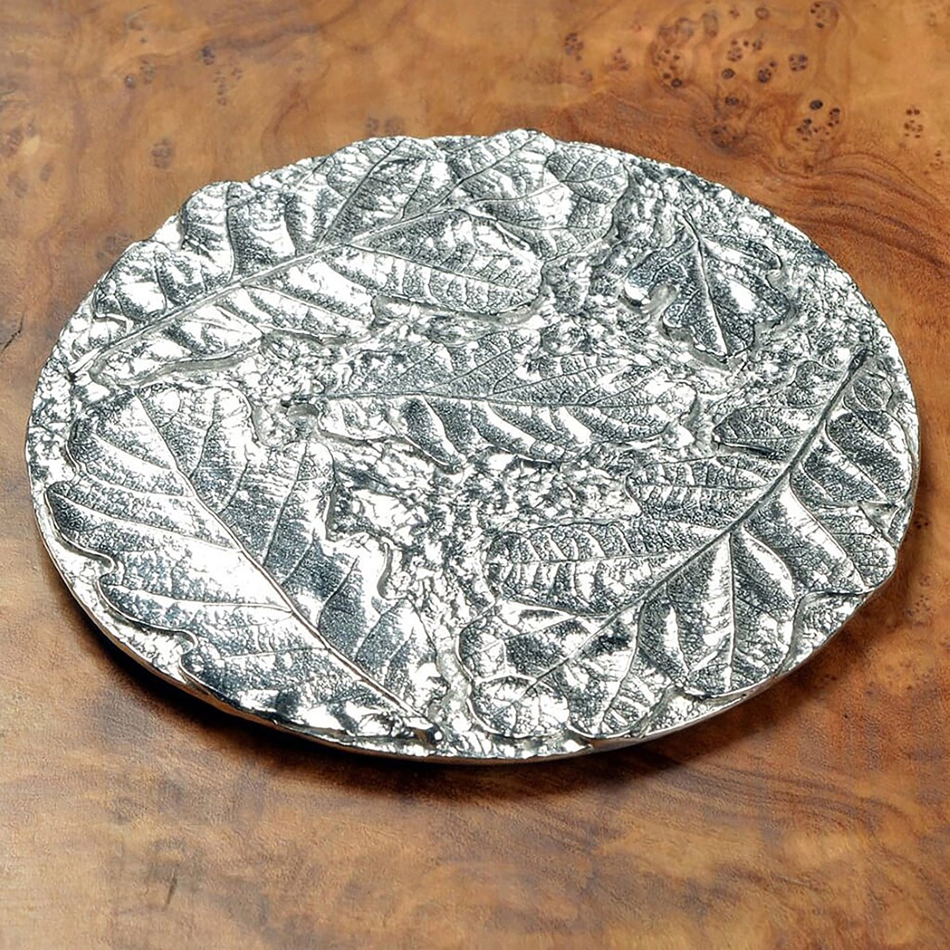 Oak leaf coaster set of 4. Each coaster is a circular composition of detailed cast oak leaves forming  actractive round pewter drinks coasters. Practical and useful housewarming gifts, ideal gifts for nature lovers, UK handmade 