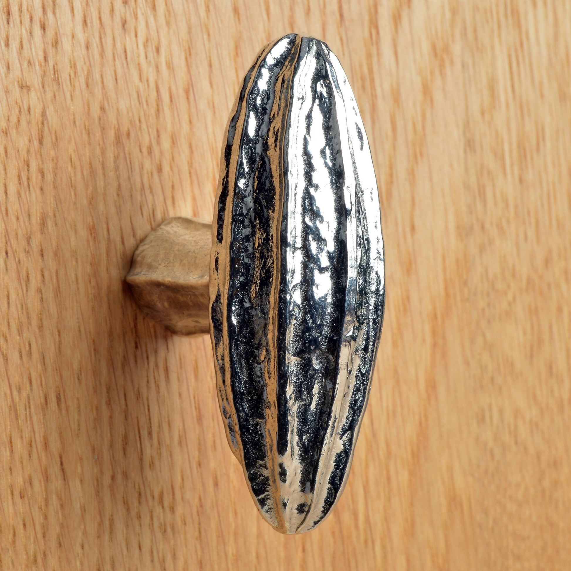 A solid pewter cabinet handle, cupboard knob, furniture handle or drawer pull in the shape of a detailed generic seed pod. Organic, unusual handles UK handmade with finesse