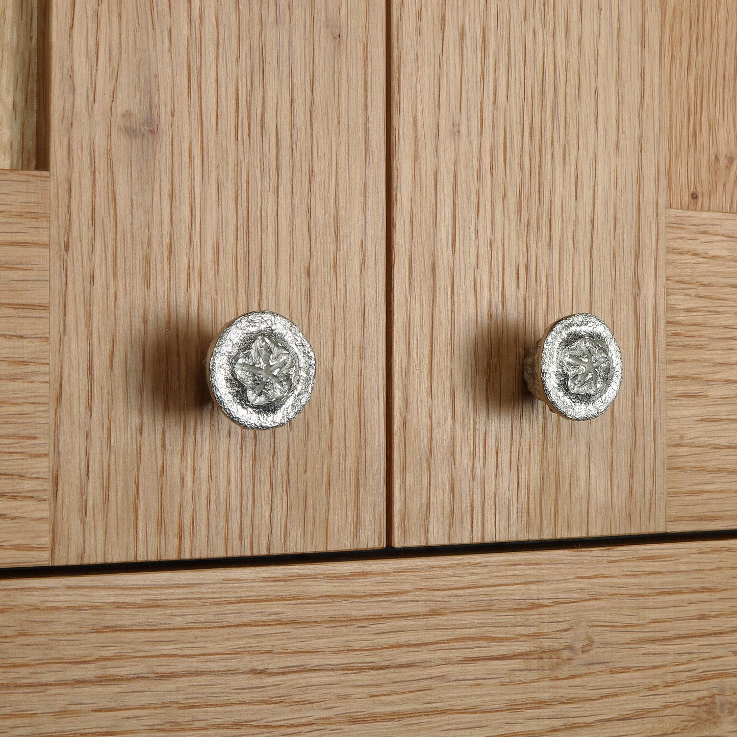 A solid pewter cabinet handle, cupboard knob, furniture handle or drawer pull in the shape of a detailed eucalyptus seed pod. Organic, unusual handles UK handmade with finesse