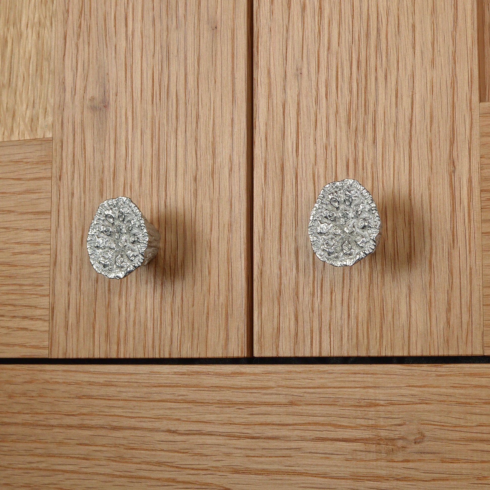 A solid pewter cabinet handle, cupboard knob, furniture handle or drawer pull in the shape of a detailed lotus seed pod. Organic, unusual handles UK handmade with finesse