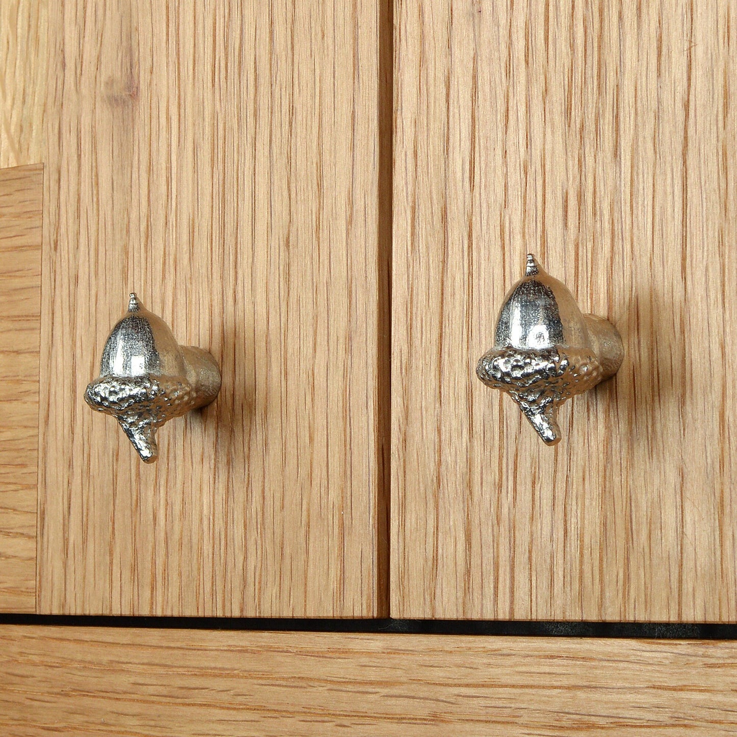 A solid pewter cabinet handle, cupboard knob, furniture handle or drawer pull in the shape of a detailed acorn. Organic, unusual handles UK handmade with finesse