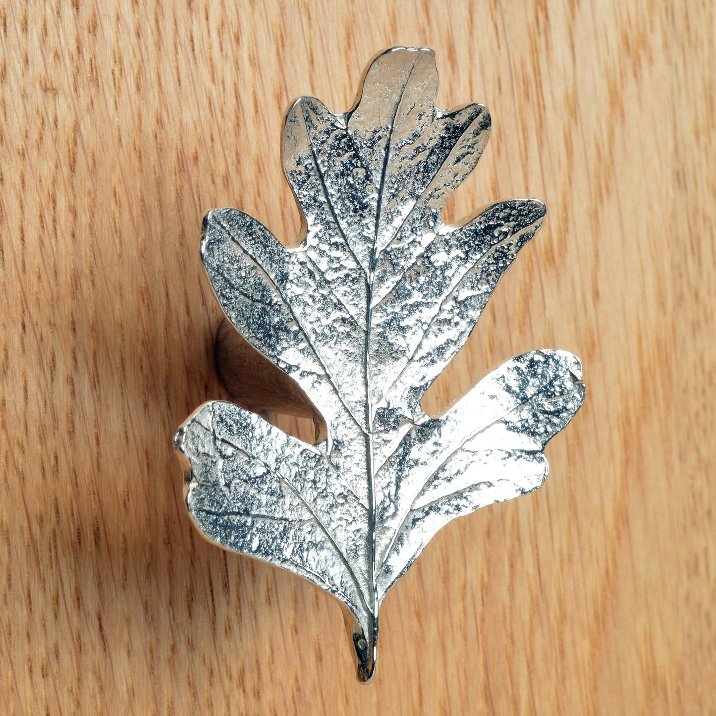 A solid pewter cabinet handle, cupboard knob, furniture handle or drawer pull in the shape of a detailed hawthorn leaf. Organic, unusual handles UK handmade with finesse