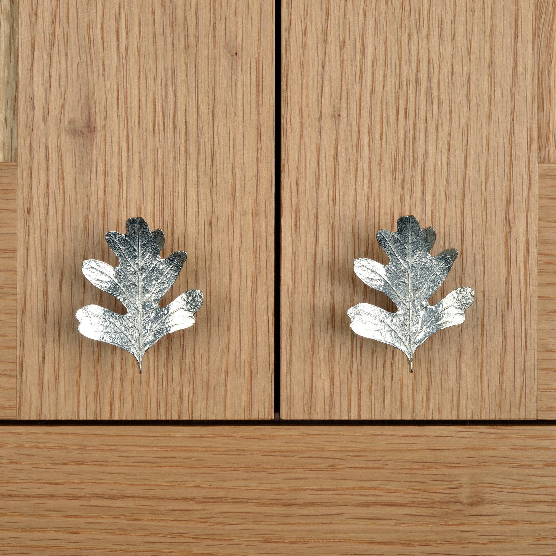 A solid pewter cabinet handle, cupboard knob, furniture handle or drawer pull in the shape of a detailed hawthorn leaf. Organic, unusual handles UK handmade with finesse