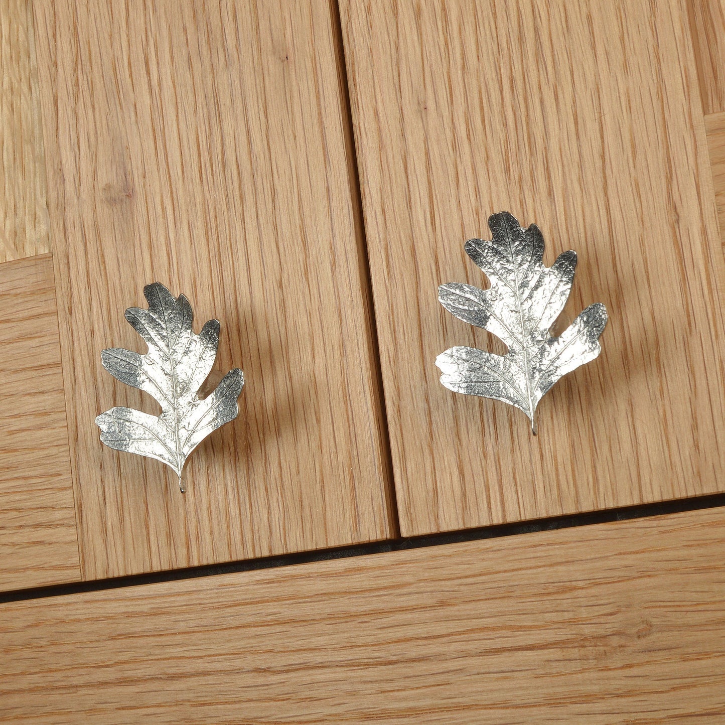 A solid pewter cabinet handle, cupboard knob, furniture handle or drawer pull in the shape of a detailed hawthorn leaf. Organic, unusual handles UK handmade with finesse