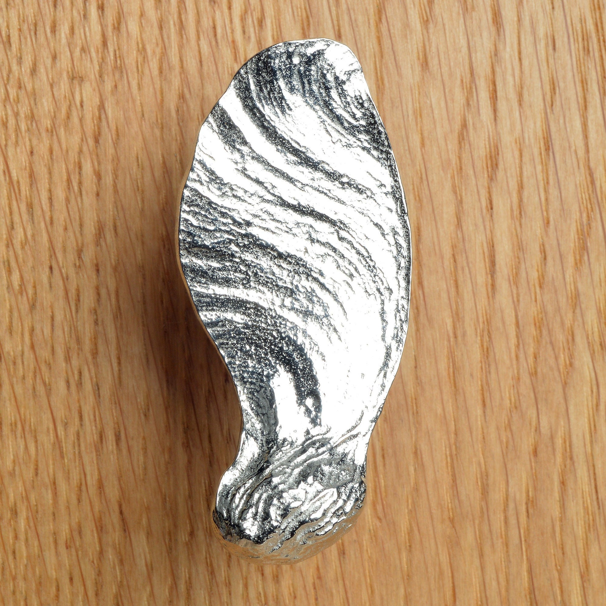 A solid pewter cabinet handle, cupboard knob, furniture handle or drawer pull in the shape of a detailed maple key, maple seed pod. Organic, unusual handles UK handmade with finesse