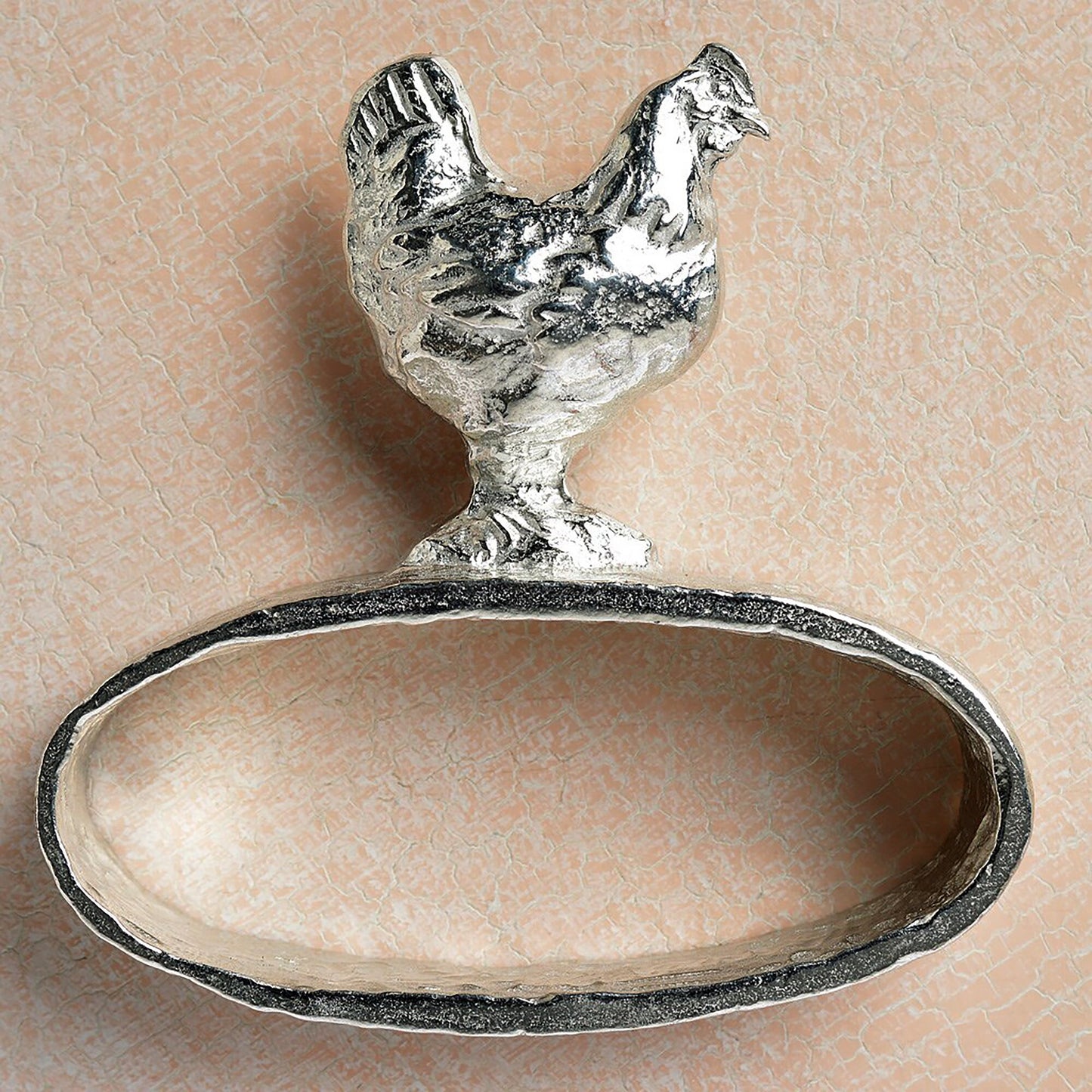 A set of 6 textured pewter oval-shaped napkin rings. Each one has a beautifully observed sculpture of a British countryside animal on top. Perfect country gifts. The set consists of a: fox, hound, chicken, duck, wren and hare.