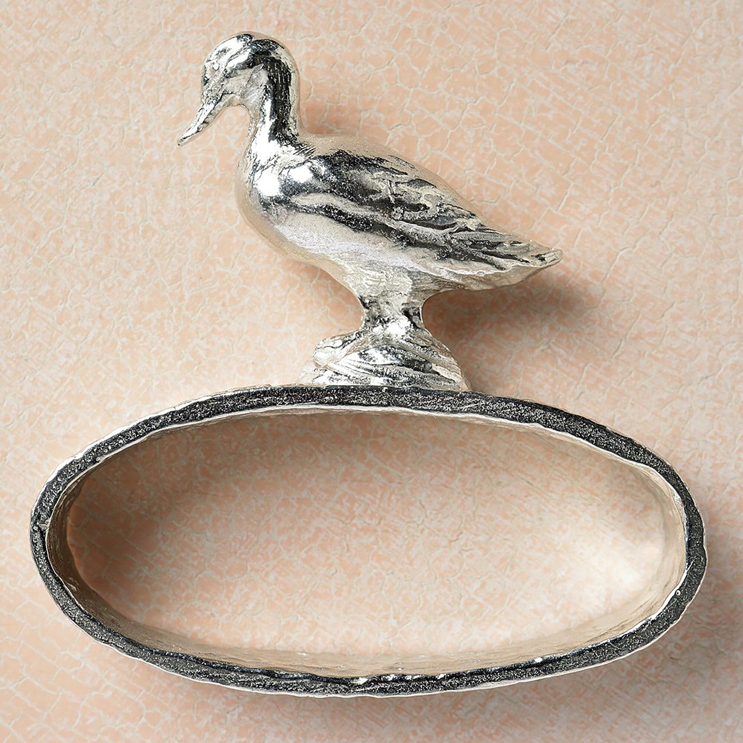 A set of 6 textured pewter oval-shaped napkin rings. Each one has a beautifully observed sculpture of a British countryside animal on top. Perfect country gifts. The set consists of a: fox, hound, chicken, duck, wren and hare.