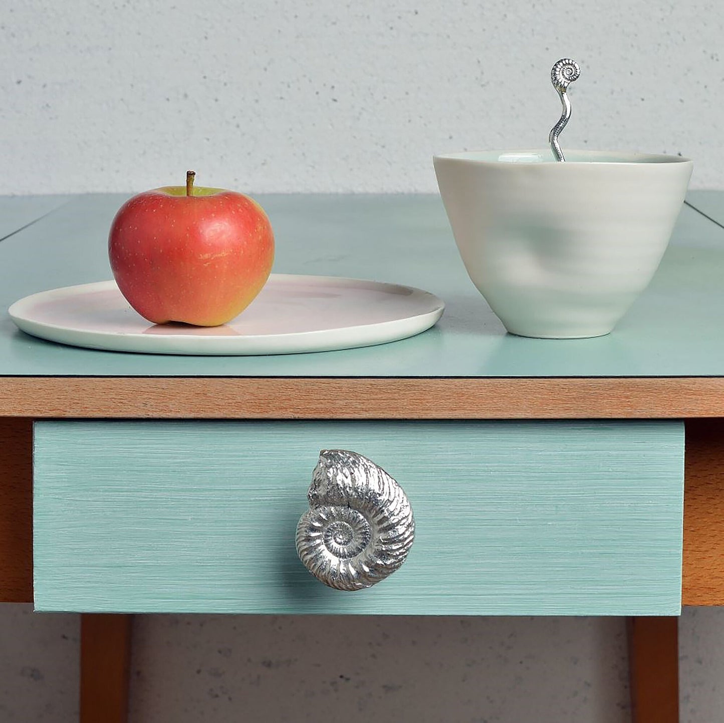 A solid pewter cabinet handle, cupboard knob, furniture handle or drawer pull in the shape of a detailed ammonite fossil. Organic, unusual handles UK handmade with finesse