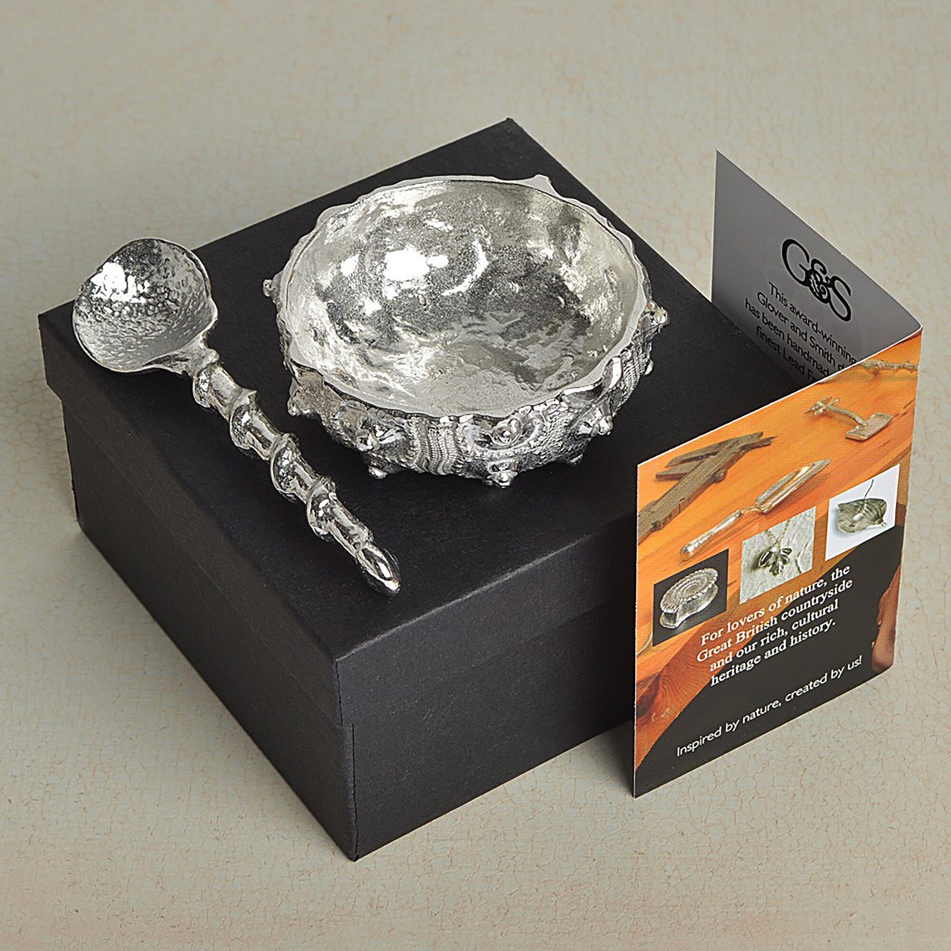 A detailed pewter sea urchin shaped bowl and spoon set.. Our sea urchin bowl is ideal for sea salt, sugar, mustard etc. The accompanying spoon has a sea shell bowl and a small shell finial on an entwining stem.