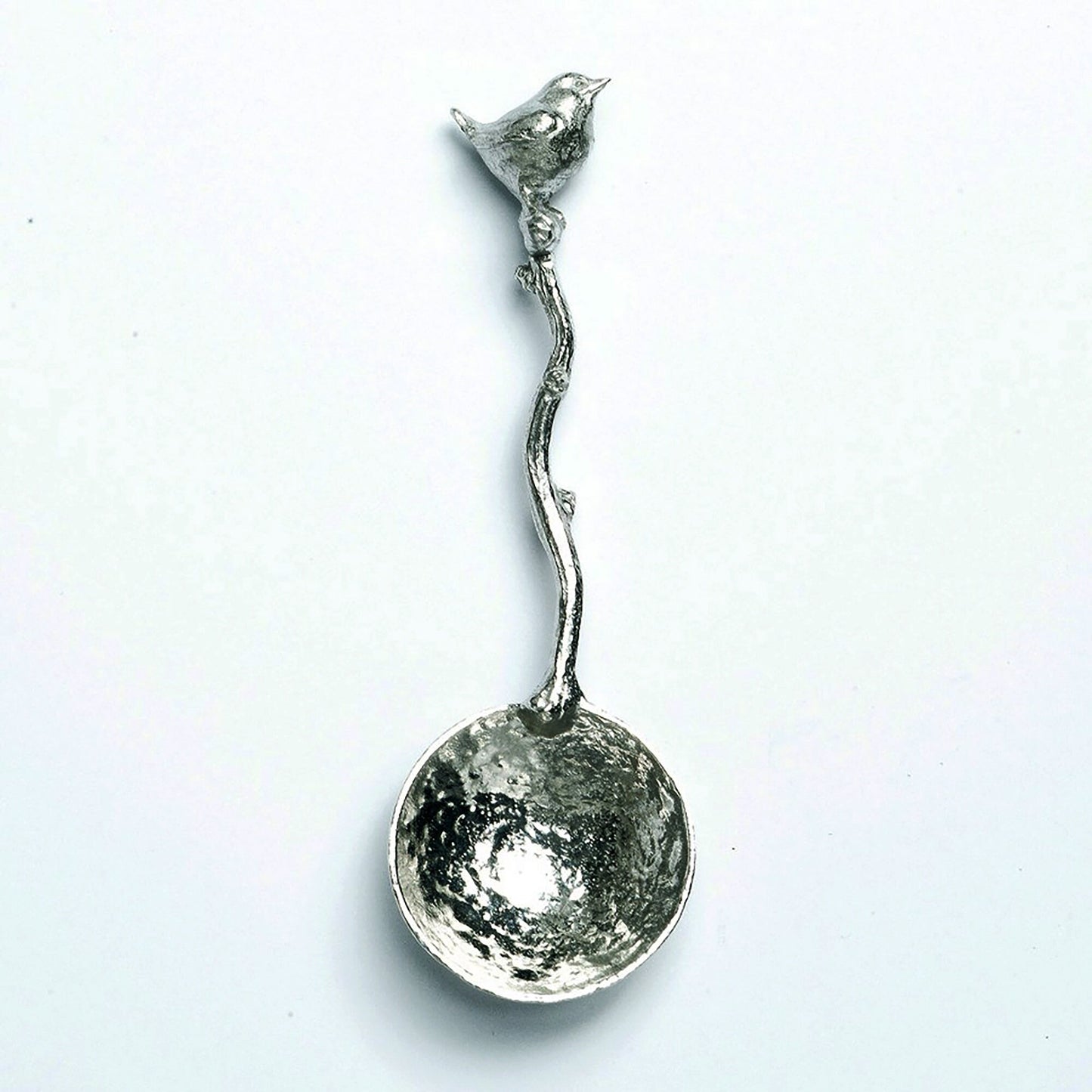 A small spoon pewter sugar spoon with a wren bird on the end of a twig handle. Unusual, useful and tactile gifts for bird lovers, Jenny wren gifts handmade in the UK