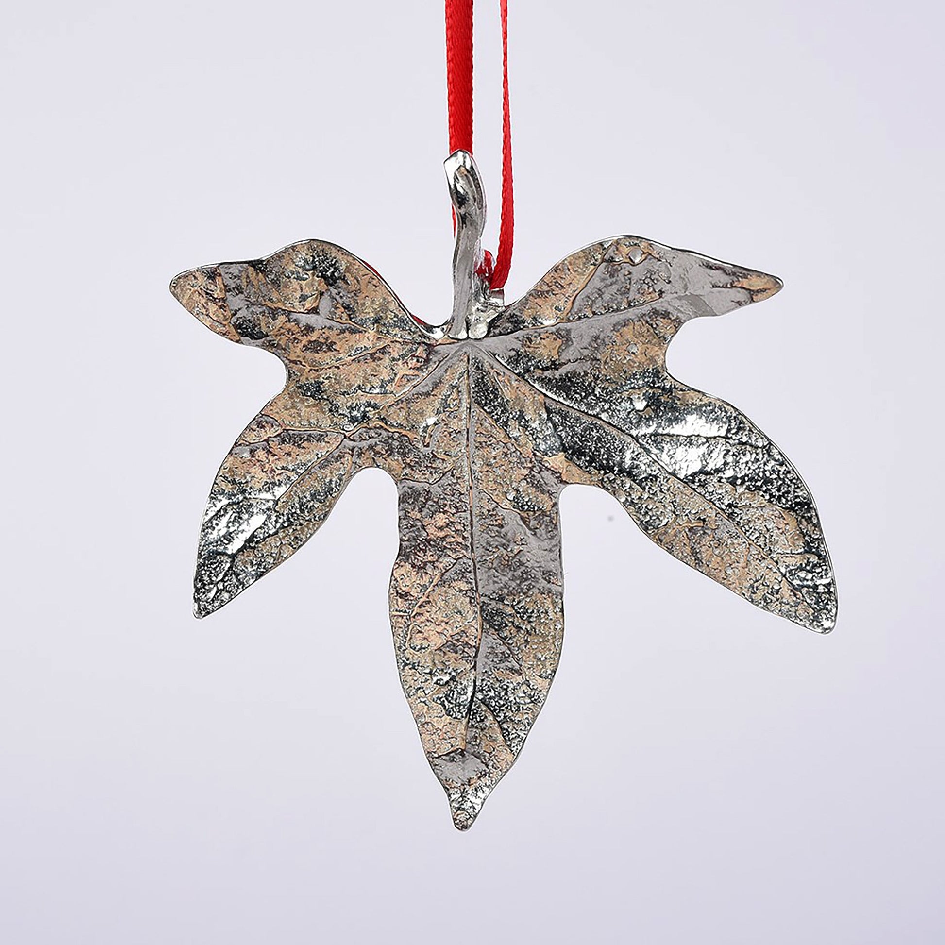 Our beautifully textured & detailed pewter Ivy leaf hangs from a red ribbon providing a gorgeous hanging Christmas tree decoration gifts. Pewter Christmas tree decorations, unusual Christmas decorations made in Britain