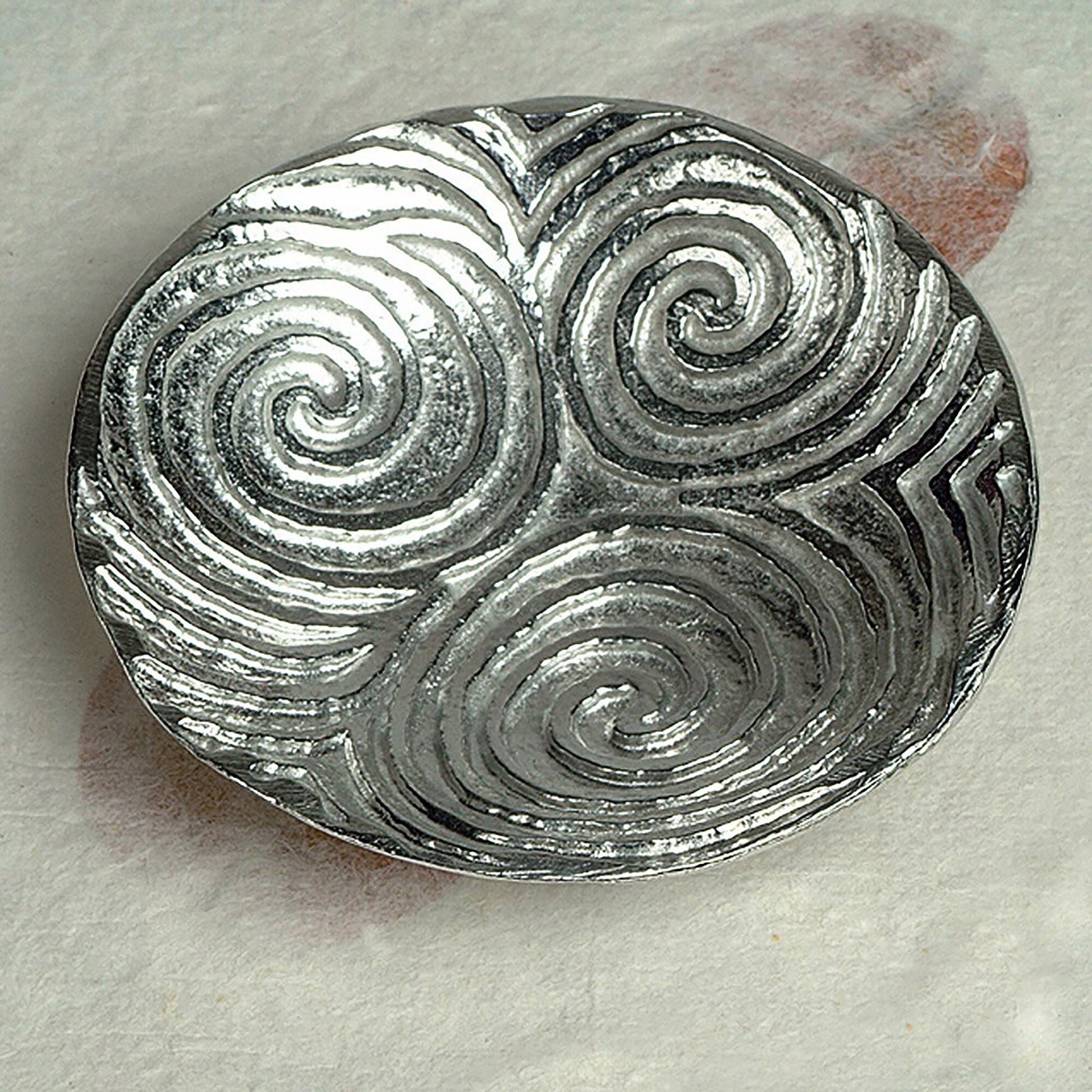 Spiral of life pewter trinket dish. Its design is based on the the triple spiral (or triskele) often called the Spiral of Life as found carved on the entrance stone at Newgrange in Ireland. Celtic spiral gifts.