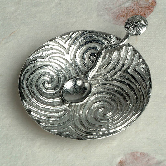 Spiral of life pewter bowl and spoon set. Its design is based on the the triple spiral (or triskele) often called the Spiral of Life as found carved on the entrance stone at Newgrange in Ireland. With matching spirals spoon. Celtic spiral gifts.