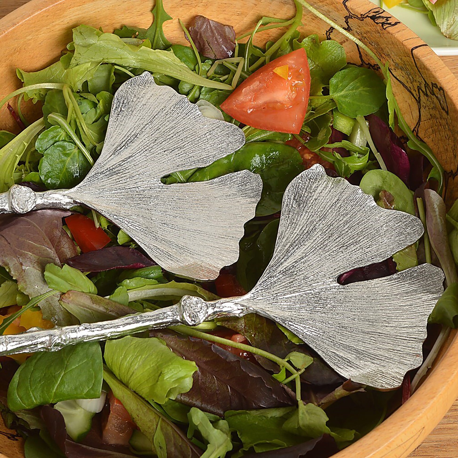 A pair of leaf design salad servers with ginkgo leaf spoons on detailed twig textured handles. Pewter serving spoons handmade in the UK. A perfect 10th (Tin) ten year wedding anniversary gift (Our pewter is 95% tin). UK handmade