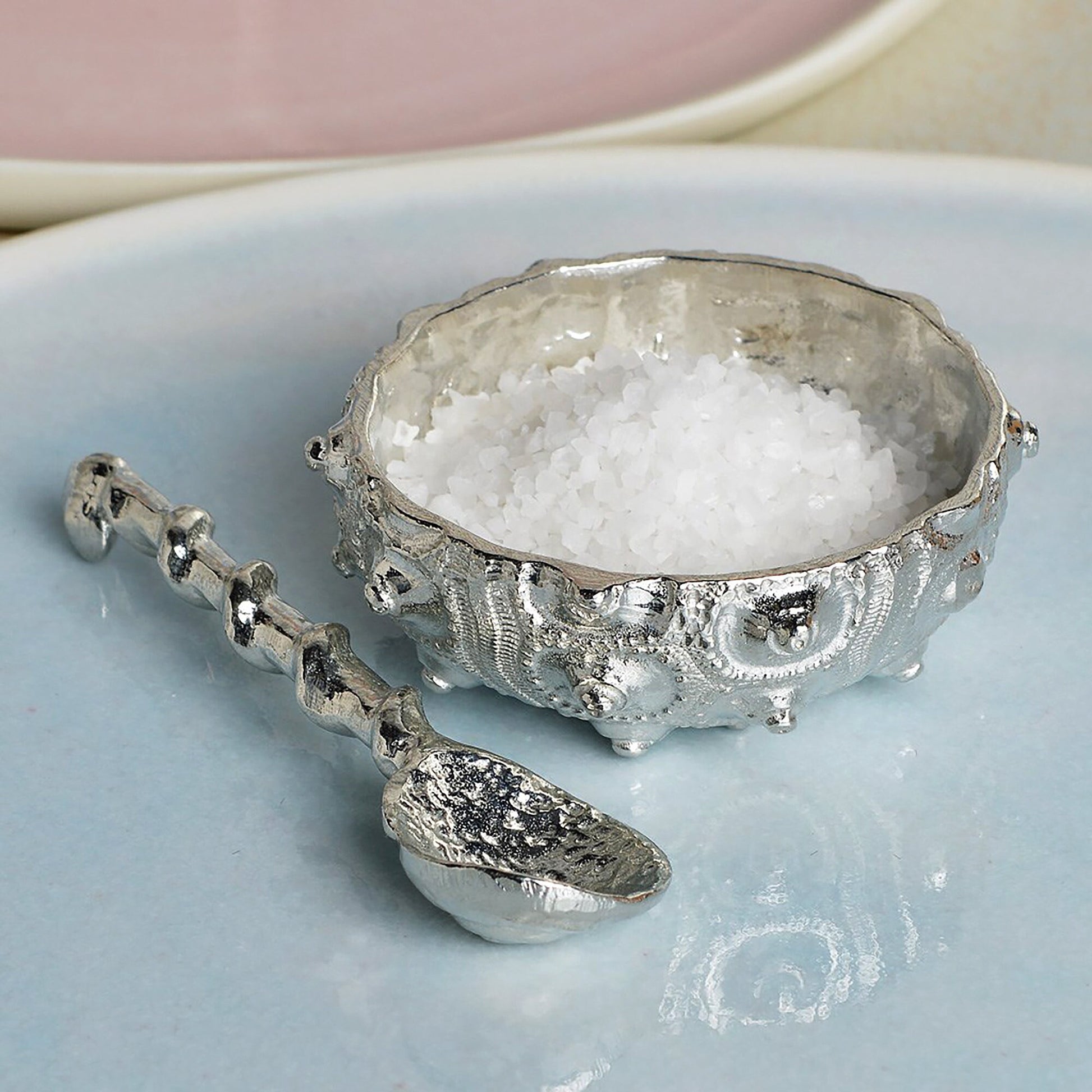 A detailed pewter sea urchin shaped bowl and spoon set.. Our sea urchin bowl is ideal for sea salt, sugar, mustard etc. The accompanying spoon has a sea shell bowl and a small shell finial on an entwining stem.