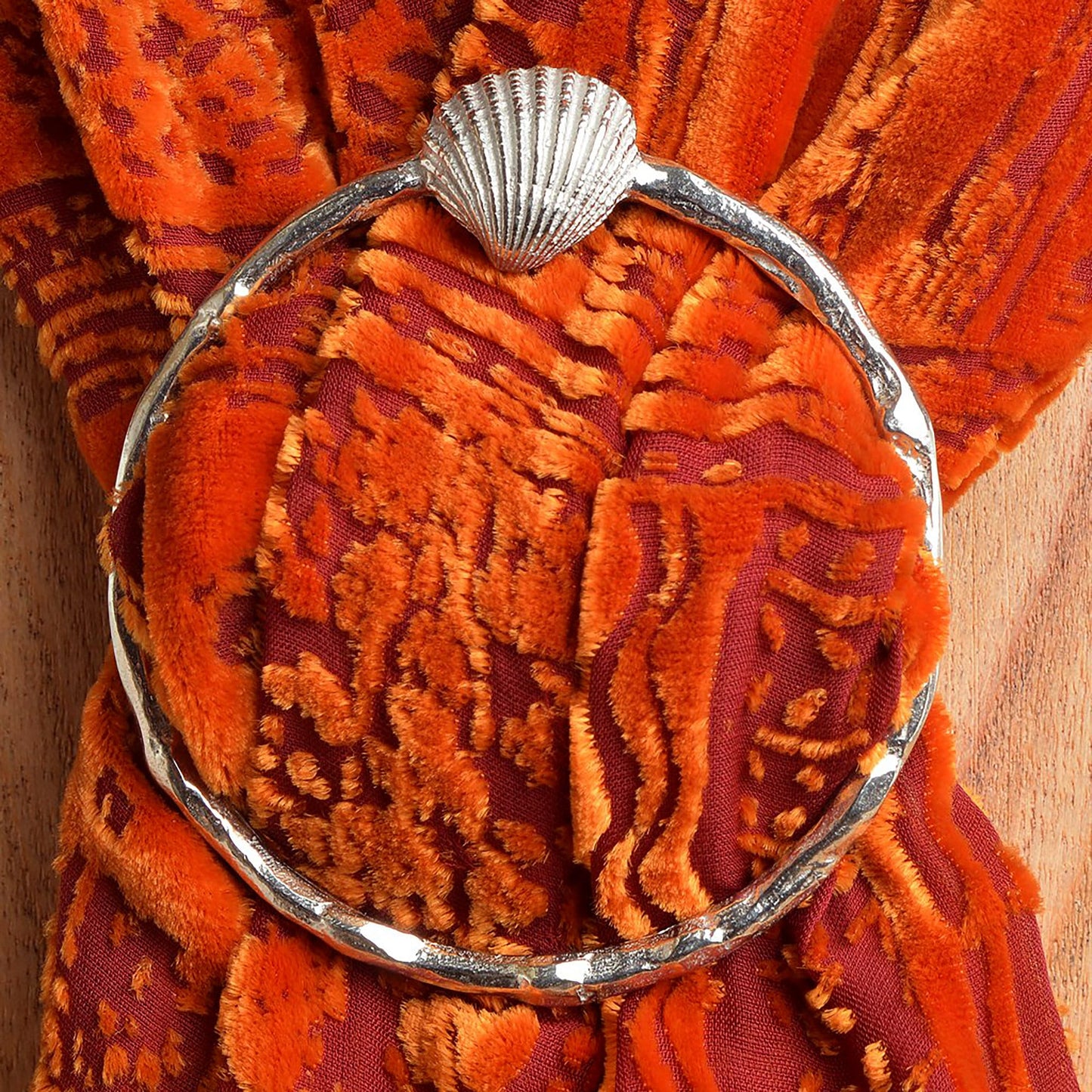 Shell scarf ring. A detailed seashell sits on the top of a coral textured ring on this decorative pewter ring for scarves. It will fit most large velvet, silk, cotton or wool scarves. Nautical gifts, seaside gifts, holiday gifts