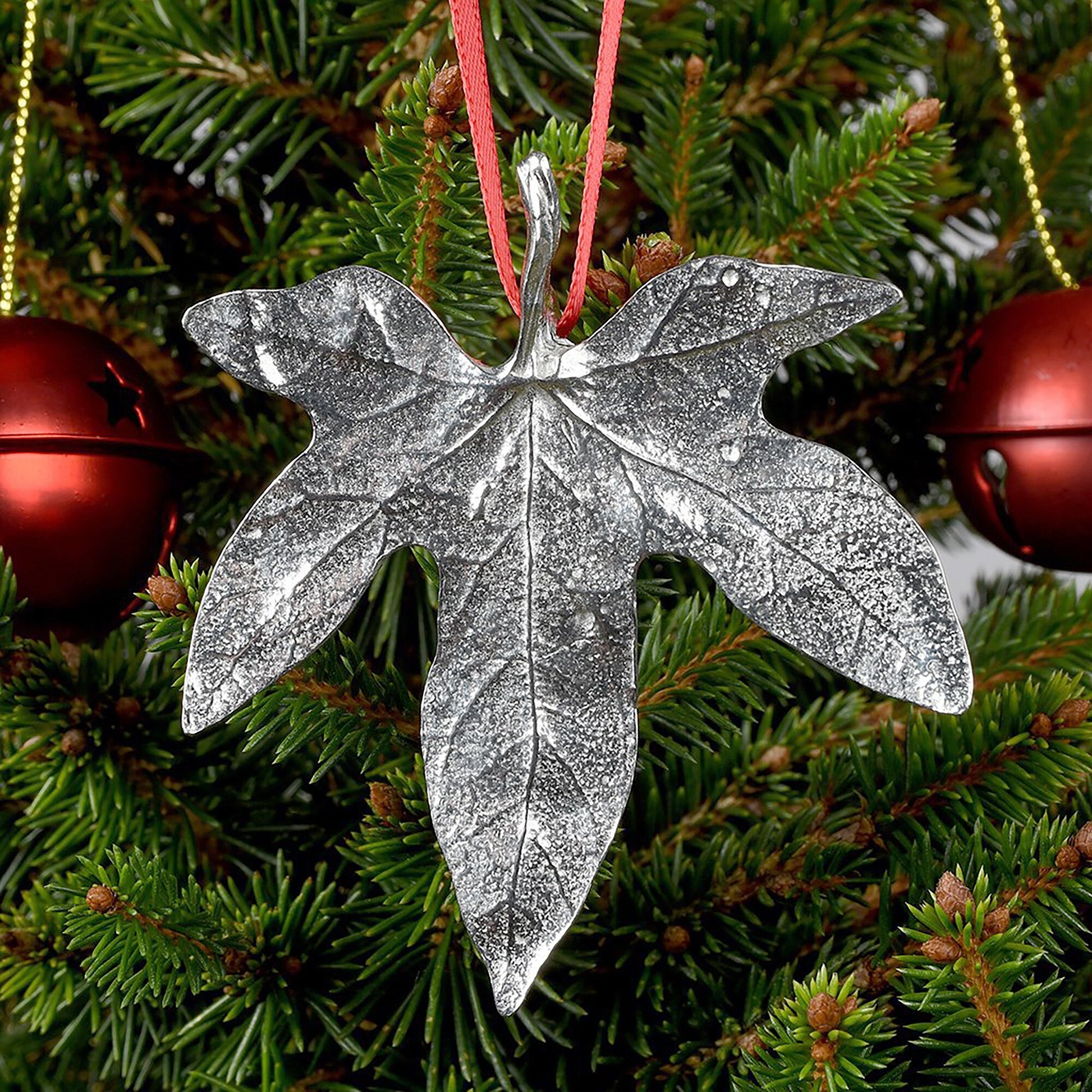 Our beautifully textured & detailed pewter Ivy leaf hangs from a red ribbon providing a gorgeous hanging Christmas tree decoration gifts. Pewter Christmas tree decorations, unusual Christmas decorations made in Britain