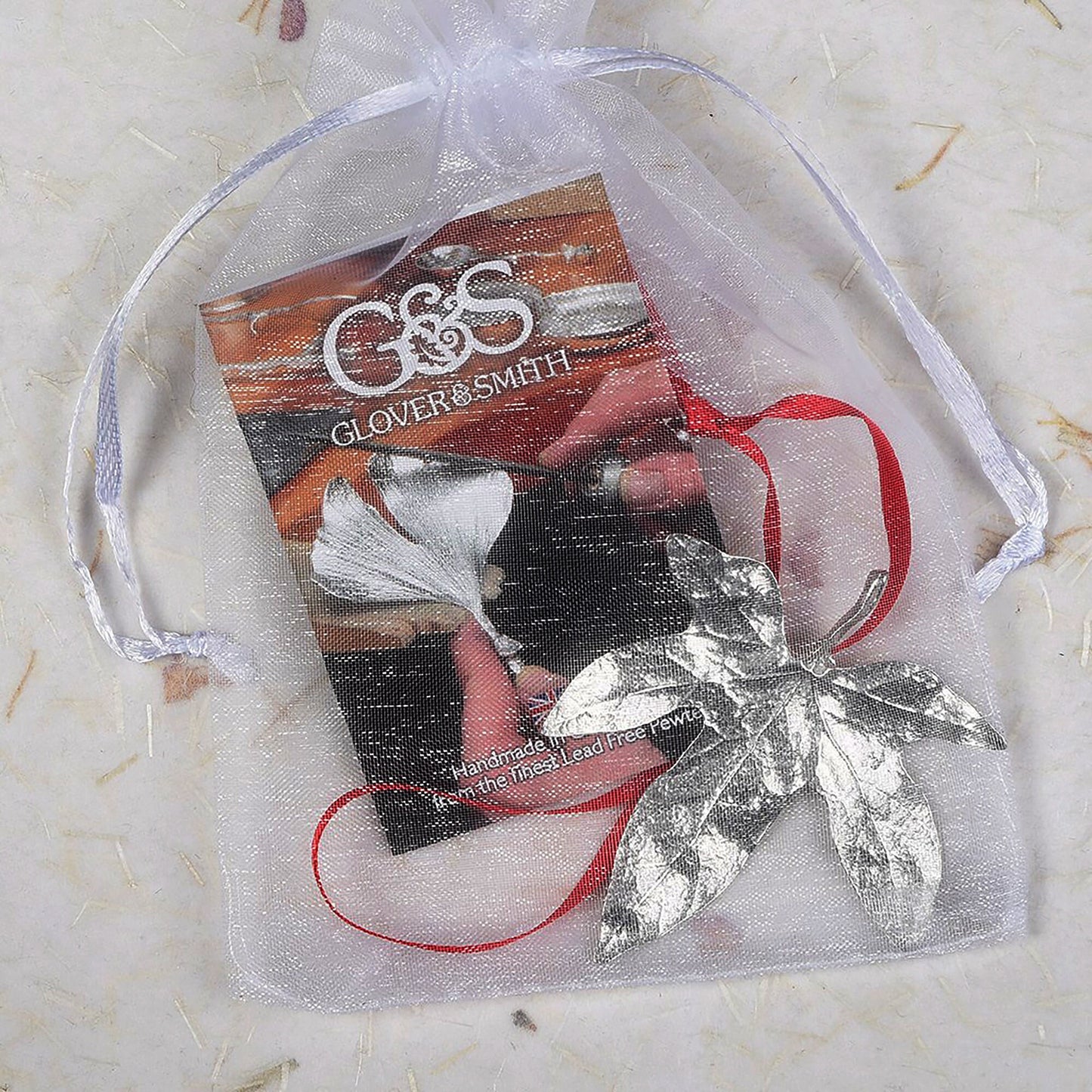 Our beautifully textured & detailed pewter Ivy leaf hangs from a red ribbon providing a gorgeous hanging Christmas tree decoration gifts. Pewter Christmas tree decorations, unusual Christmas decorations made in Britain